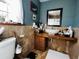 Cozy bathroom features a unique, custom countertop and decorative mirror at 4360 Se 62Nd St, Ocala, FL 34480