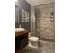 Stylish bathroom with a wood-look tile shower and patterned tile floor at 4360 Se 62Nd St, Ocala, FL 34480