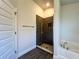 A bright bathroom features a tub and tiled shower with glass door at 4373 Sw 90Th Pl, Ocala, FL 34476