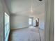 Bright primary bedroom featuring fresh paint, plush carpet, and great natural light at 4373 Sw 90Th Pl, Ocala, FL 34476