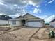 Charming single-story home featuring a two-car garage and classic architectural details at 4373 Sw 90Th Pl, Ocala, FL 34476