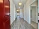 Inviting entryway featuring wood-look tile flooring and neutral paint, leading into the home at 4373 Sw 90Th Pl, Ocala, FL 34476