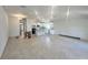 Spacious living area featuring recessed lighting, tile floors, and a stylish open kitchen area at 4373 Sw 90Th Pl, Ocala, FL 34476