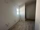 Bathroom with wood-look tile flooring and a walk-in shower at 4429 Sw 90Th Pl, Ocala, FL 34476