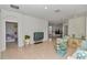 Living room with tile floor, view into kitchen, and comfortable seating at 5365 Nw 46Th Lane Rd, Ocala, FL 34482