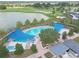 Community pool with shade structures, lounge chairs, and landscaping at 5365 Nw 46Th Lane Rd, Ocala, FL 34482