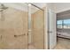 Walk-in shower with glass enclosure and grab bar at 5365 Nw 46Th Lane Rd, Ocala, FL 34482