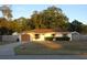 Single story home with attached garage and fenced yard at 5465 Ne 12Th Ave, Ocala, FL 34479