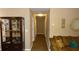 Long hallway with light walls and wood-look flooring at 5465 Ne 12Th Ave, Ocala, FL 34479