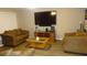 Living room with brown couches and large TV at 5465 Ne 12Th Ave, Ocala, FL 34479