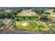 Aerial view of a golf course with lush greens and sand traps at 6861 Sw 179Th Avenue Rd, Dunnellon, FL 34432