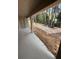 Covered patio looking out into the backyard and mature trees, perfect for outdoor enjoyment at 7 Nw 45Th Loop, Ocala, FL 34470