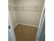 Walk-in closet showing neutral walls and carpet with metal shelving at 7 Nw 45Th Loop, Ocala, FL 34470