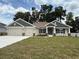 Charming single-Gathering home with a 3-car garage, landscaped yard, and inviting curb appeal in a well-maintained neighborhood at 7 Nw 45Th Loop, Ocala, FL 34470