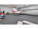 Spacious airplane hangar with seating area and plane at 7225 Se 92Nd St, Ocala, FL 34472