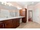 Double vanity bathroom with walk-in shower and linen closet at 7316 Sw 94Th Ct, Ocala, FL 34481