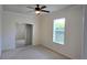 Bedroom featuring neutral walls, carpet, mirrored closet, and a window offering natural light at 7316 Sw 94Th Ct, Ocala, FL 34481