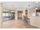 Dining area with sliding glass doors leading to a screened lanai at 7316 Sw 94Th Ct, Ocala, FL 34481