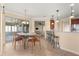 Dining area with table and chairs, and view into the living room at 7316 Sw 94Th Ct, Ocala, FL 34481