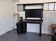 Organized garage workshop with workbench and overhead storage at 7316 Sw 94Th Ct, Ocala, FL 34481