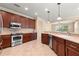 Modern kitchen with stainless steel appliances and wood cabinets at 7316 Sw 94Th Ct, Ocala, FL 34481