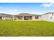 Large grassy backyard and covered patio at 7884 Sw 59Th St, Ocala, FL 34474