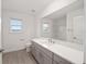 Bright bathroom with granite countertops, modern fixtures and large mirror at 7884 Sw 59Th St, Ocala, FL 34474