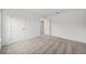 Bedroom featuring neutral carpeting, white walls, and closet doors at 7884 Sw 59Th St, Ocala, FL 34474