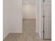 Hallway with white walls, trim, and baseboards showcasing seamless transition and neutral design elements at 7884 Sw 59Th St, Ocala, FL 34474