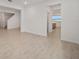 Living room showcasing light, neutral tile flooring throughout with open concept design elements at 7884 Sw 59Th St, Ocala, FL 34474