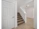 Bright staircase with carpeted stairs and white painted trim at 7884 Sw 59Th St, Ocala, FL 34474