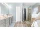 Spa-like bathroom with double vanity, walk-in shower, and soaking tub at 8120 Sw 56Th Ter, Ocala, FL 34476