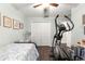 Spacious bedroom with a twin bed and elliptical at 8120 Sw 56Th Ter, Ocala, FL 34476