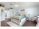 Charming bedroom with a queen-size bed and wood floors at 8120 Sw 56Th Ter, Ocala, FL 34476