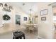 Bright dining area with a round table and chairs, view into kitchen at 8120 Sw 56Th Ter, Ocala, FL 34476