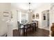 Formal dining room with wood table, bench, and gray chairs at 8120 Sw 56Th Ter, Ocala, FL 34476