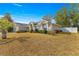 Side view of a single-story house with a fenced backyard at 8120 Sw 56Th Ter, Ocala, FL 34476