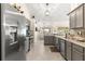 Modern kitchen with stainless steel appliances and gray cabinets at 8120 Sw 56Th Ter, Ocala, FL 34476