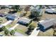 Aerial view of a house with a driveway and surrounding homes at 8274 Sw 106Th Pl, Ocala, FL 34481