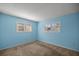 Light blue bedroom with neutral carpeting and window shutters at 8274 Sw 106Th Pl, Ocala, FL 34481