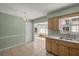 Simple kitchen featuring wood cabinets, a double sink and window at 8274 Sw 106Th Pl, Ocala, FL 34481