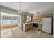 Cozy kitchen with light wood cabinets and a breakfast nook at 8274 Sw 106Th Pl, Ocala, FL 34481