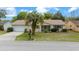 Well-maintained single-story residence boasting a lovely lawn and inviting curb appeal at 8450 Sw 115Th Street Rd, Ocala, FL 34481