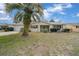 Charming single-story home featuring an attached garage and a welcoming front porch at 8450 Sw 115Th Street Rd, Ocala, FL 34481