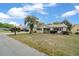 Single Gathering home in a suburban neighborhood with a manicured lawn and a prominent mailbox at 8450 Sw 115Th Street Rd, Ocala, FL 34481