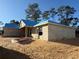 Unfinished house under construction, block walls, and a blue tarp roof at 8781 Se 161St Pl, Summerfield, FL 34491