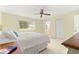 Main bedroom with king bed and ensuite bathroom access at 8785 Sw 91St St # B, Ocala, FL 34481