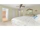 Bright bedroom with large bed, ensuite bathroom access, and ample closet space at 8785 Sw 91St St # B, Ocala, FL 34481