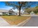 Community view showcasing villas, landscaping, and a tree at 8785 Sw 91St St # B, Ocala, FL 34481