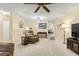 Bright living room with brown leather furniture and ceiling fan at 8785 Sw 91St St # B, Ocala, FL 34481